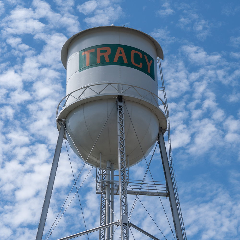water tower with clouds